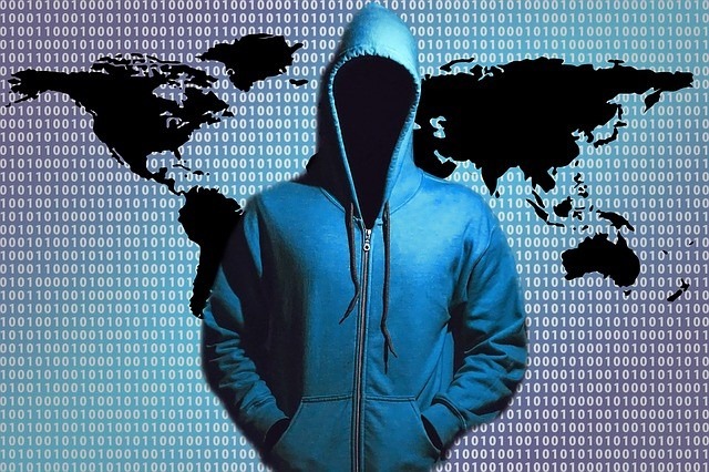 Negative SEO Attack Risk and Other Threats. Can Hackers Harm Your Website’s SEO? | Featured Image of a Hooded Person