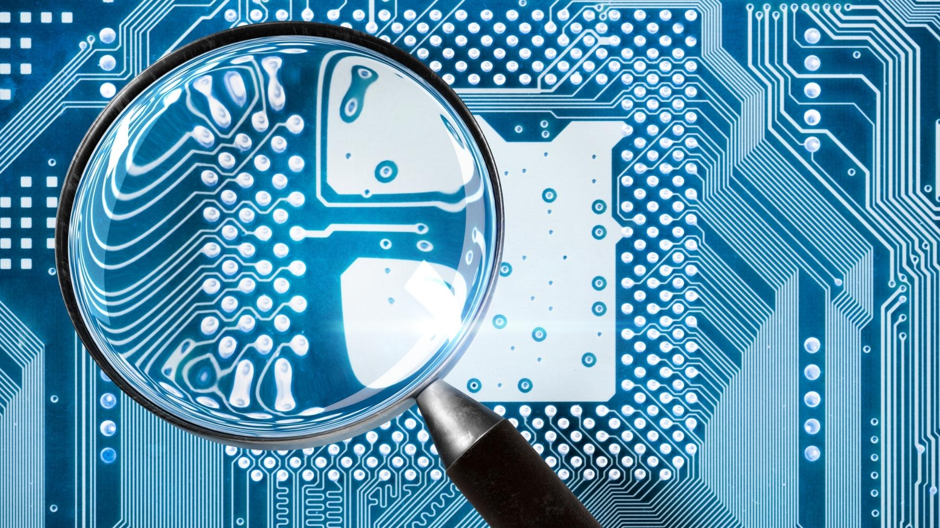 Microscope on Motherboard [Featured Image For Exaplaining Cybersecurity Audits] | TTT Blog